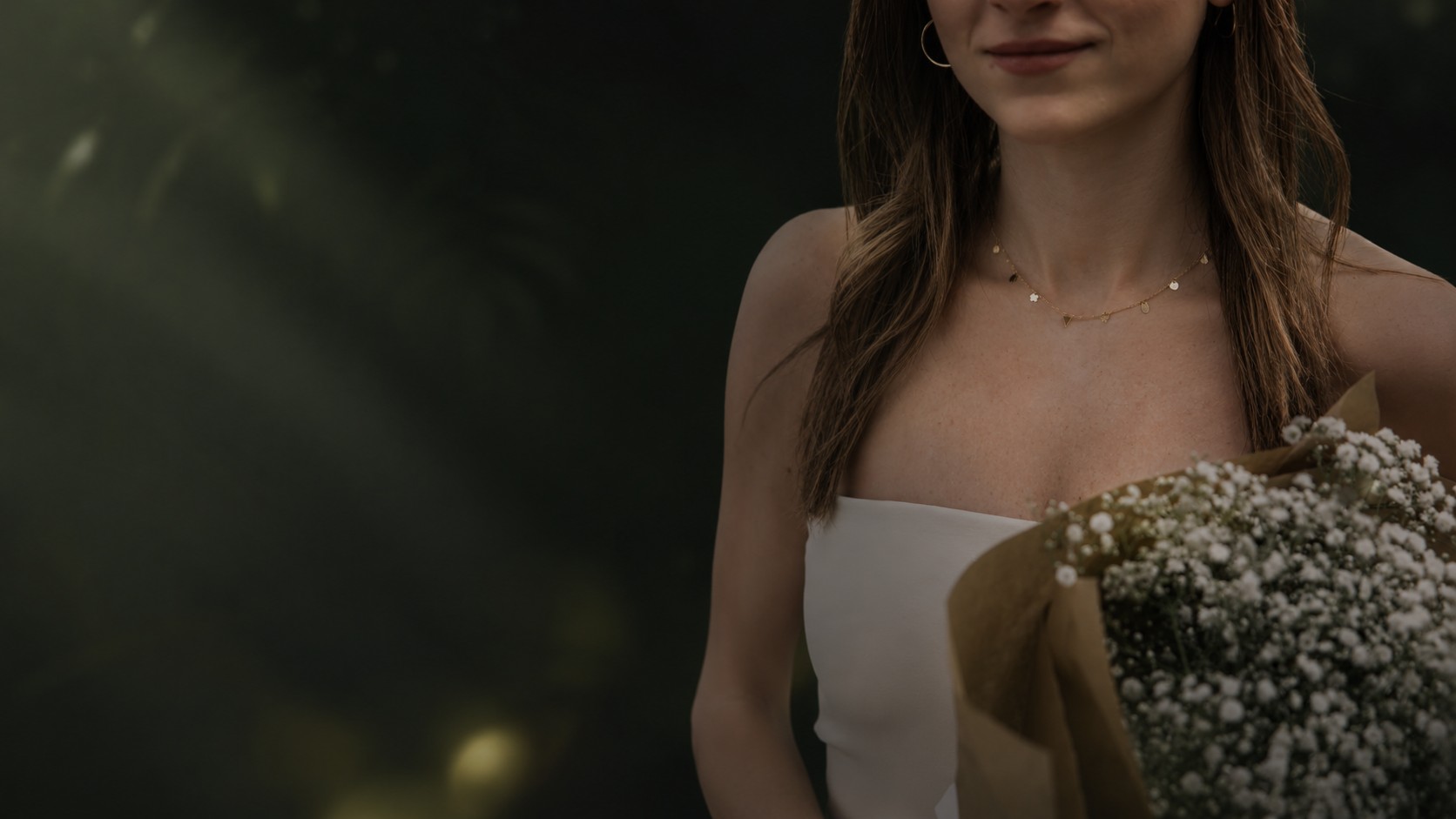 By Tina Khoury gold jewelry with white florals